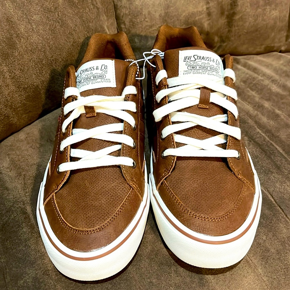 Men’s shoes size 9 1/2 the brand of these shoes are “Levis”.